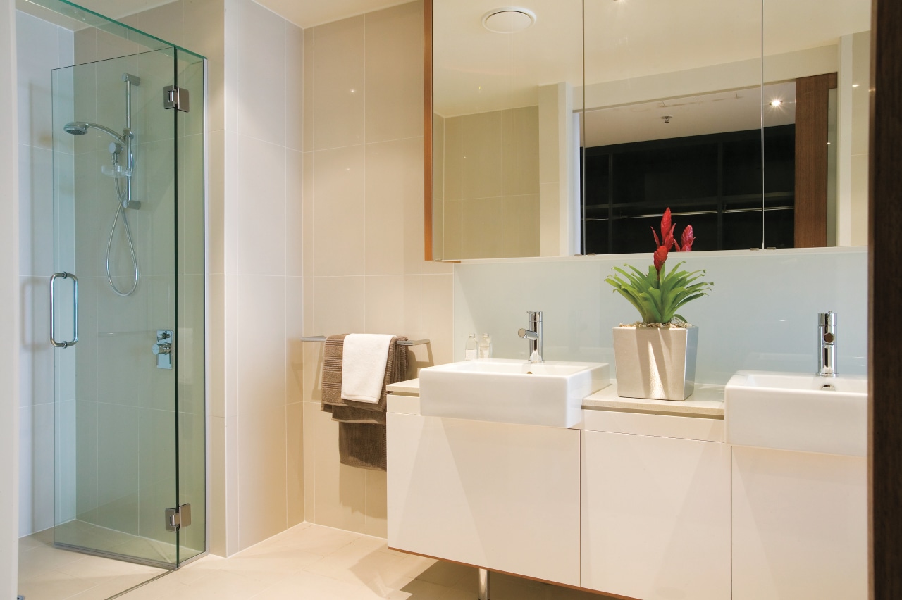 A view of the bathroom featuring tiled walls/flooring, bathroom, bathroom accessory, floor, home, interior design, room, gray