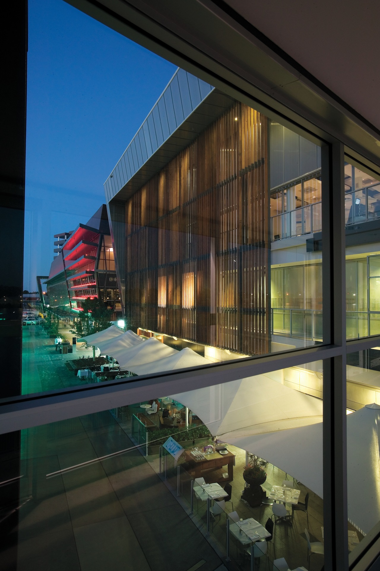 An exterior view of the Restaurants & shops apartment, architecture, building, condominium, corporate headquarters, daylighting, facade, glass, home, house, interior design, mixed use, reflection, window, black