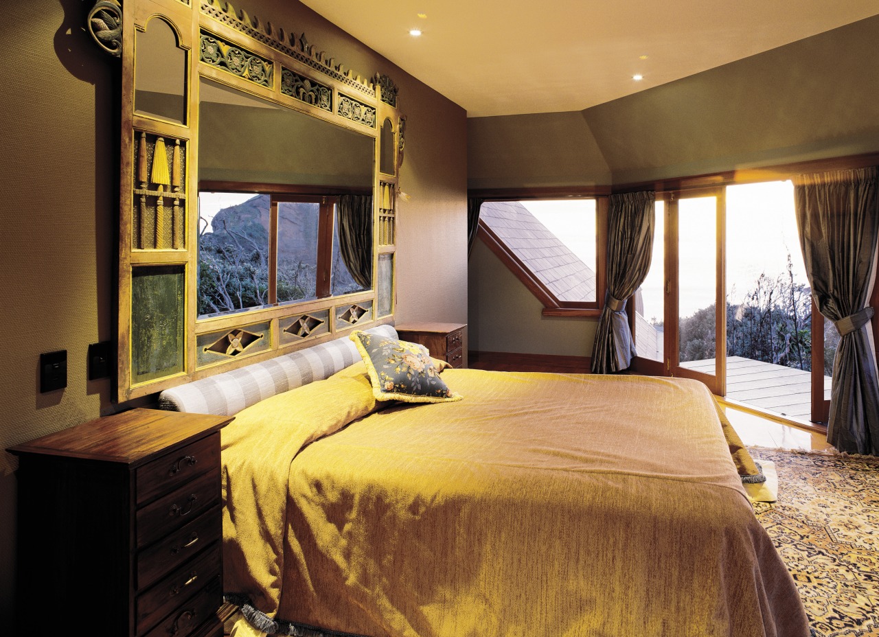 a view of the aster bedroom featuring bed, bedroom, ceiling, home, interior design, real estate, room, suite, window, brown, orange