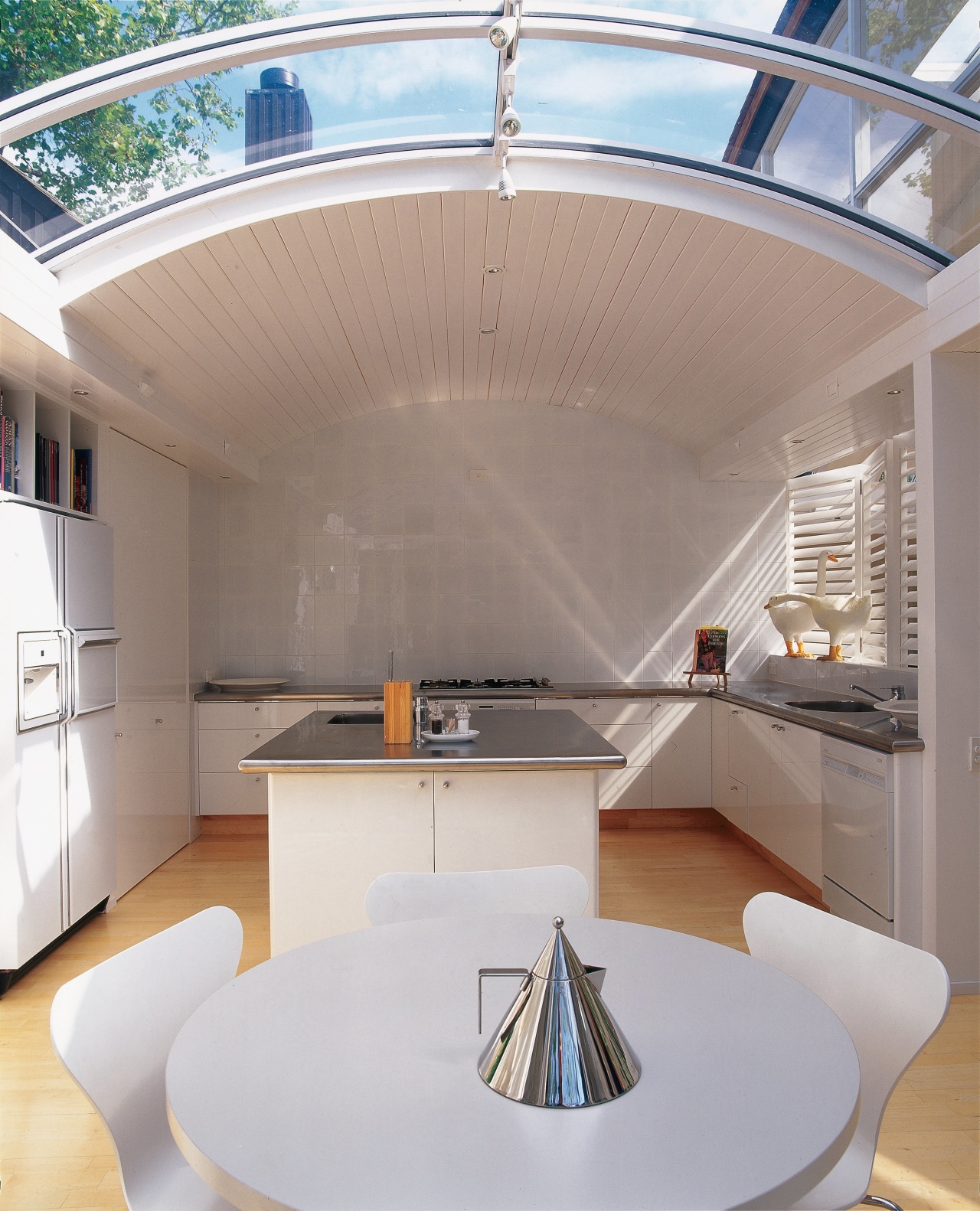 An interior view of the living areas featuring architecture, ceiling, daylighting, interior design, product design, table, gray