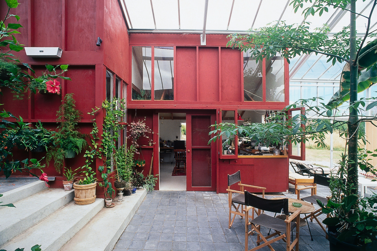 An interior view of the glasshouse where the architecture, balcony, courtyard, facade, home, house, real estate, red, white