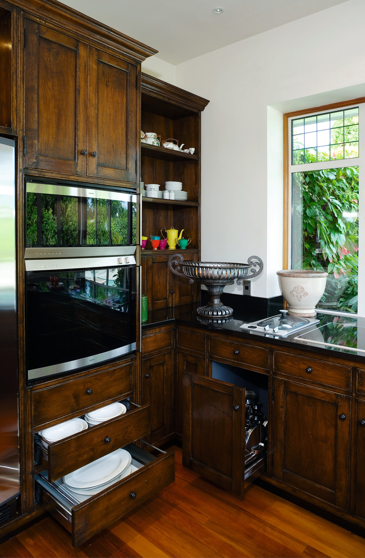 A view of this kitchen feautring solida aged cabinetry, countertop, furniture, interior design, kitchen, room, window, brown