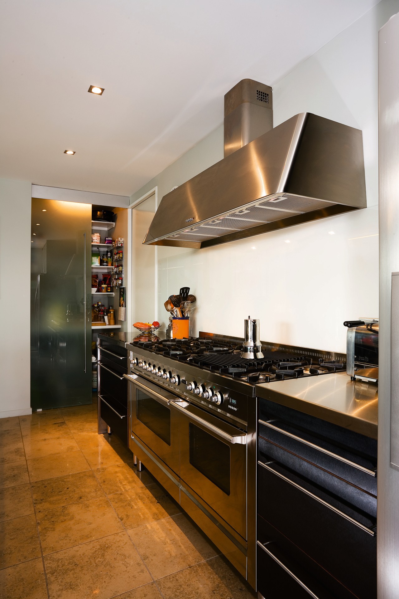 A veiw of this kitchen featuring stainless steel cabinetry, countertop, cuisine classique, home appliance, interior design, kitchen, room, gray, brown