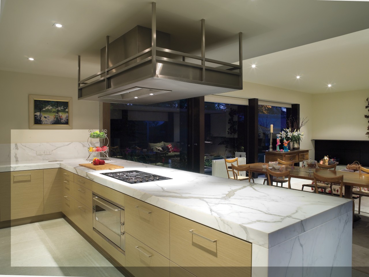 A view of this kitchen featuring clalcutta marble countertop, cuisine classique, interior design, kitchen, real estate, gray