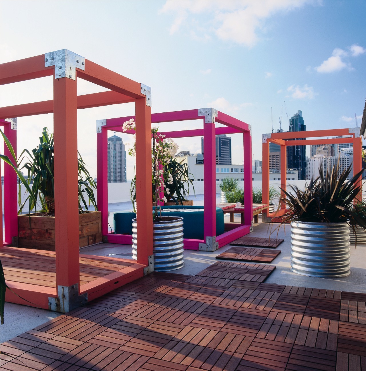 An exterior view of the patio area. deck, outdoor structure, pergola, wood, white, red