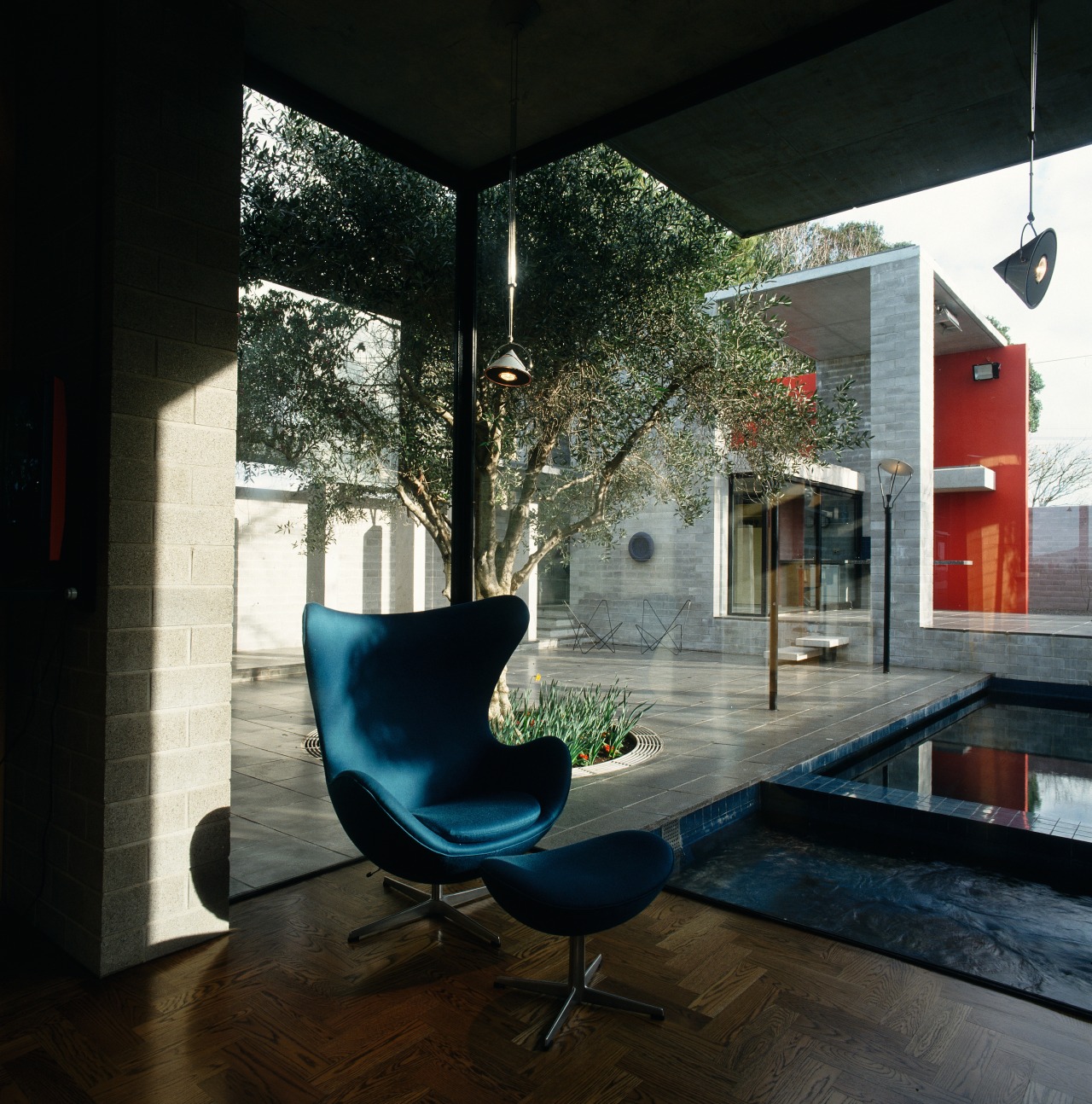 A view of the living area featuring floor architecture, chair, furniture, home, house, interior design, living room, loft, table, window, black
