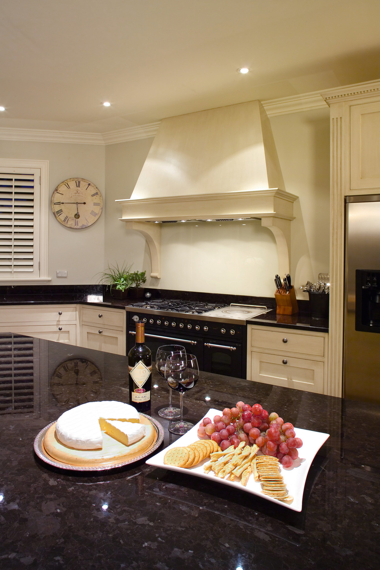 A view of this traditional kitchen featuring antique countertop, interior design, kitchen, living room, room, orange, black