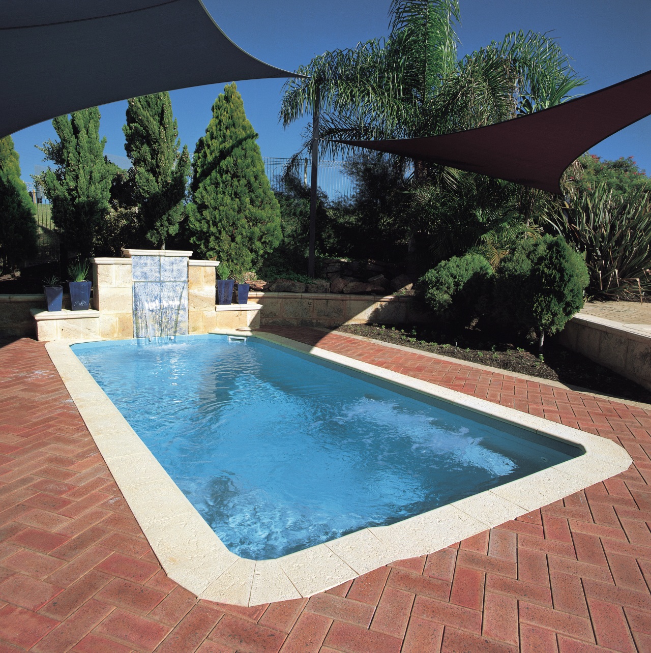 A view of a swimming pool by Aqua backyard, estate, leisure, property, real estate, swimming pool, water, water feature, black
