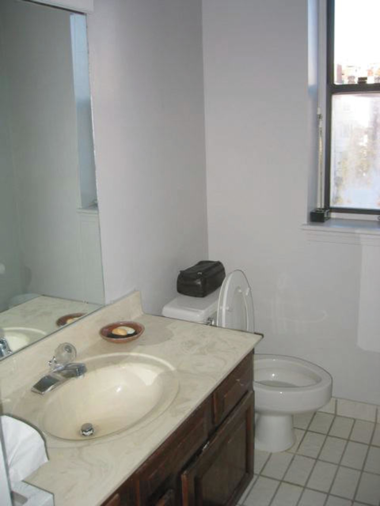 A view of the kitchen area before it bathroom, bathroom accessory, bidet, floor, home, plumbing fixture, property, room, sink, tap, tile, toilet seat, gray