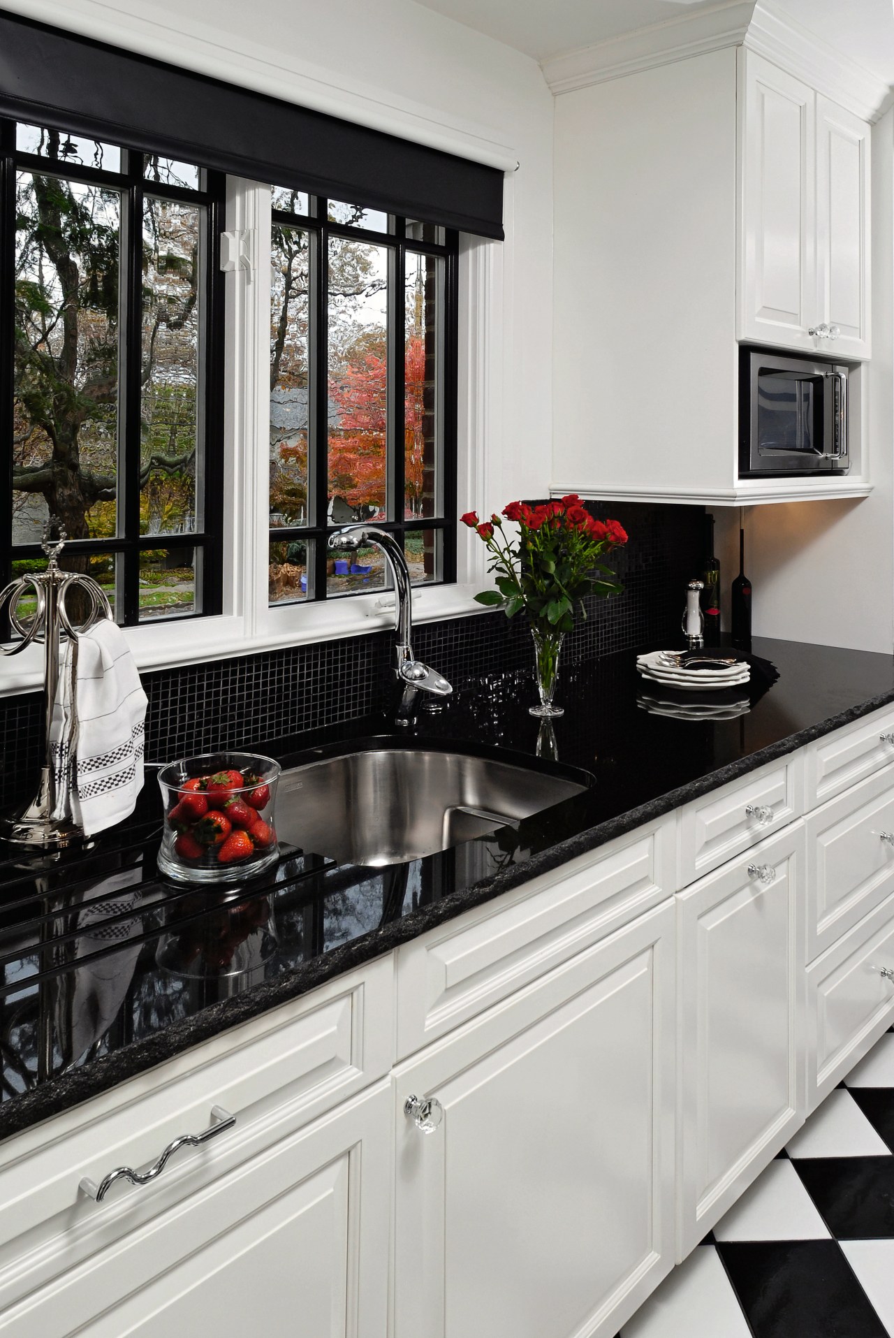 A view of this kitchen featuring black and cabinetry, countertop, cuisine classique, home appliance, interior design, kitchen, kitchen appliance, gray, black