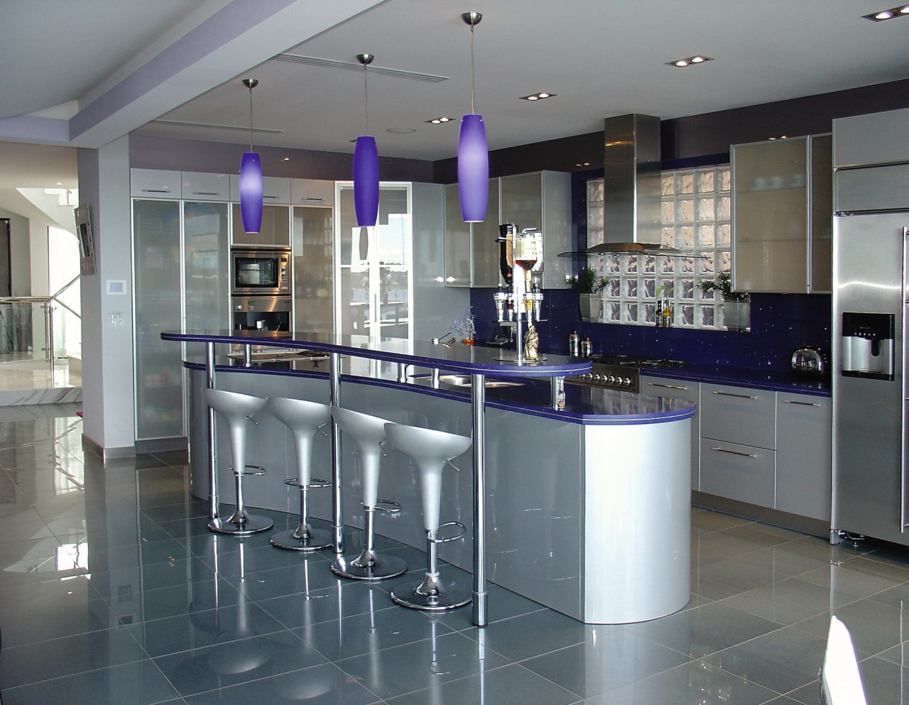 A view of a kitchen by Italcrafts. countertop, floor, flooring, interior design, kitchen, real estate, gray