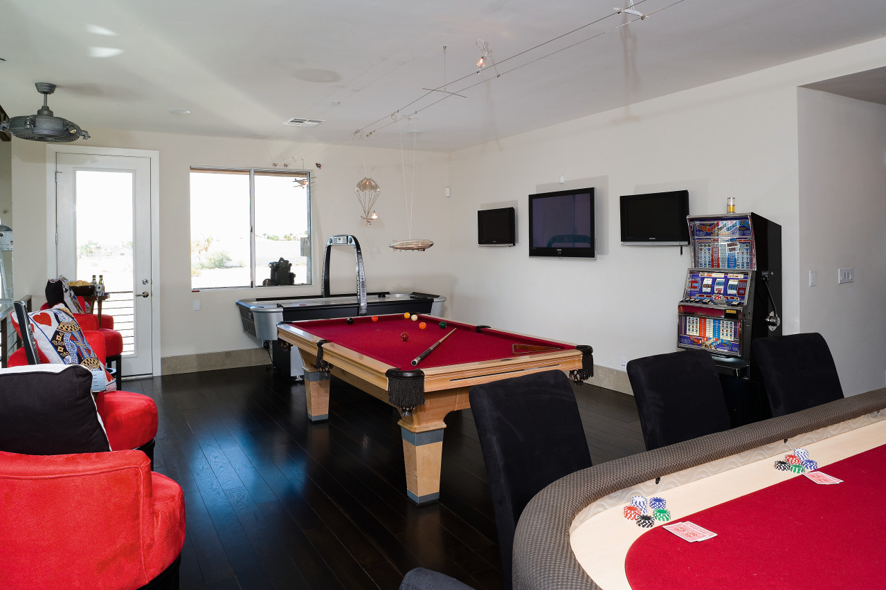 A view of the games room featuring pool billiard room, interior design, real estate, recreation room, room, table, gray