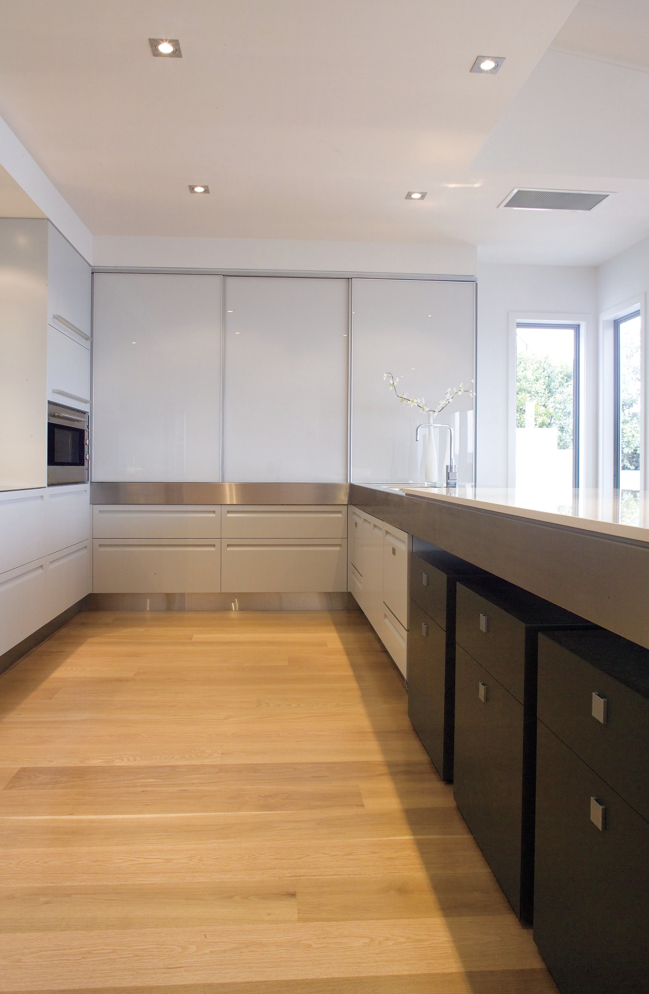 A view of this Kitchen designed by Fyfe cabinetry, ceiling, countertop, daylighting, floor, flooring, hardwood, interior design, kitchen, laminate flooring, property, real estate, room, wood, wood flooring, gray