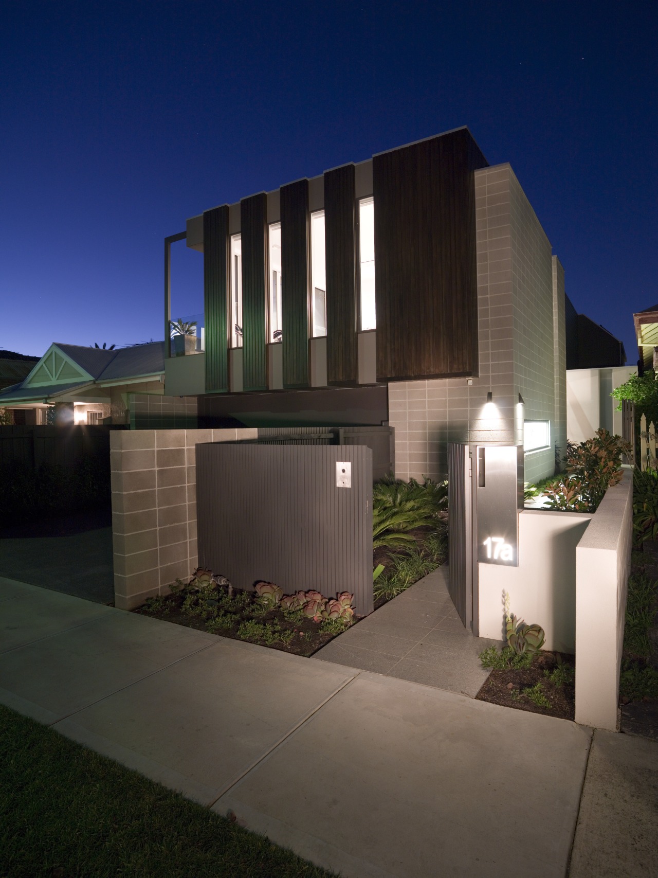 A cantilevered first storey adds a sculptural elemnt architecture, building, condominium, estate, facade, home, house, property, real estate, residential area, black, blue