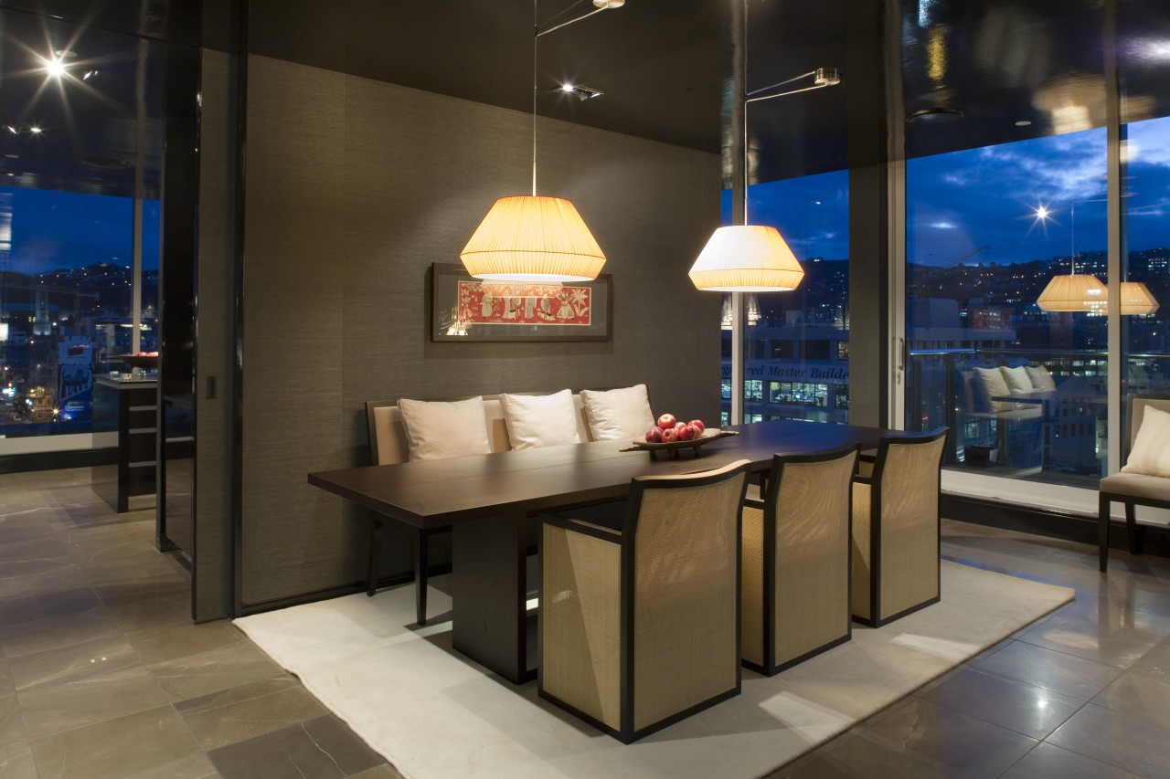 A view of the stairs featuring glass ballustradng, interior design, table, black