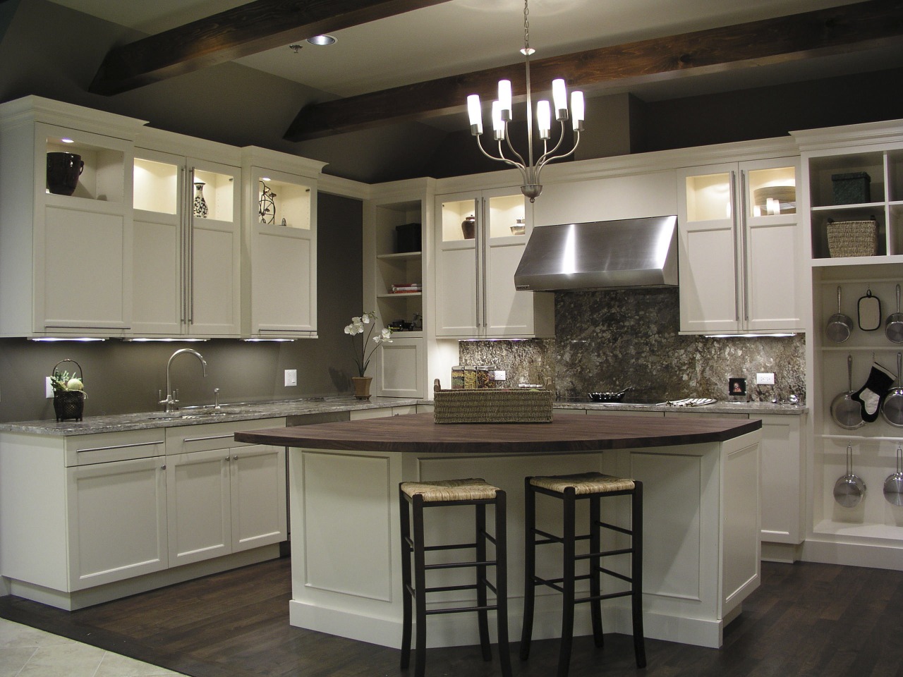 A view of the remodelled interior of this cabinetry, countertop, cuisine classique, flooring, interior design, kitchen, room, under cabinet lighting, gray, black