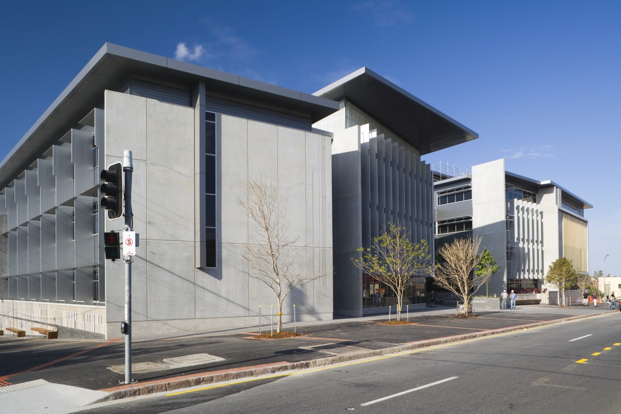 An exterior view of the greensquare building. The architecture, building, commercial building, corporate headquarters, facade, headquarters, house, mixed use, real estate, sky, gray