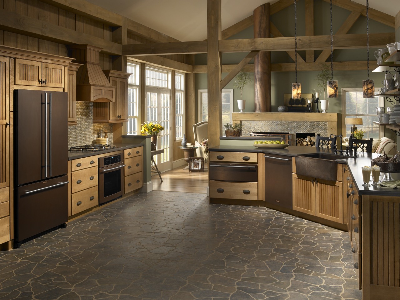 The richly hued Oiled Bronze collection of appliances cabinetry, countertop, cuisine classique, floor, flooring, hardwood, interior design, kitchen, laminate flooring, room, tile, wood flooring, brown