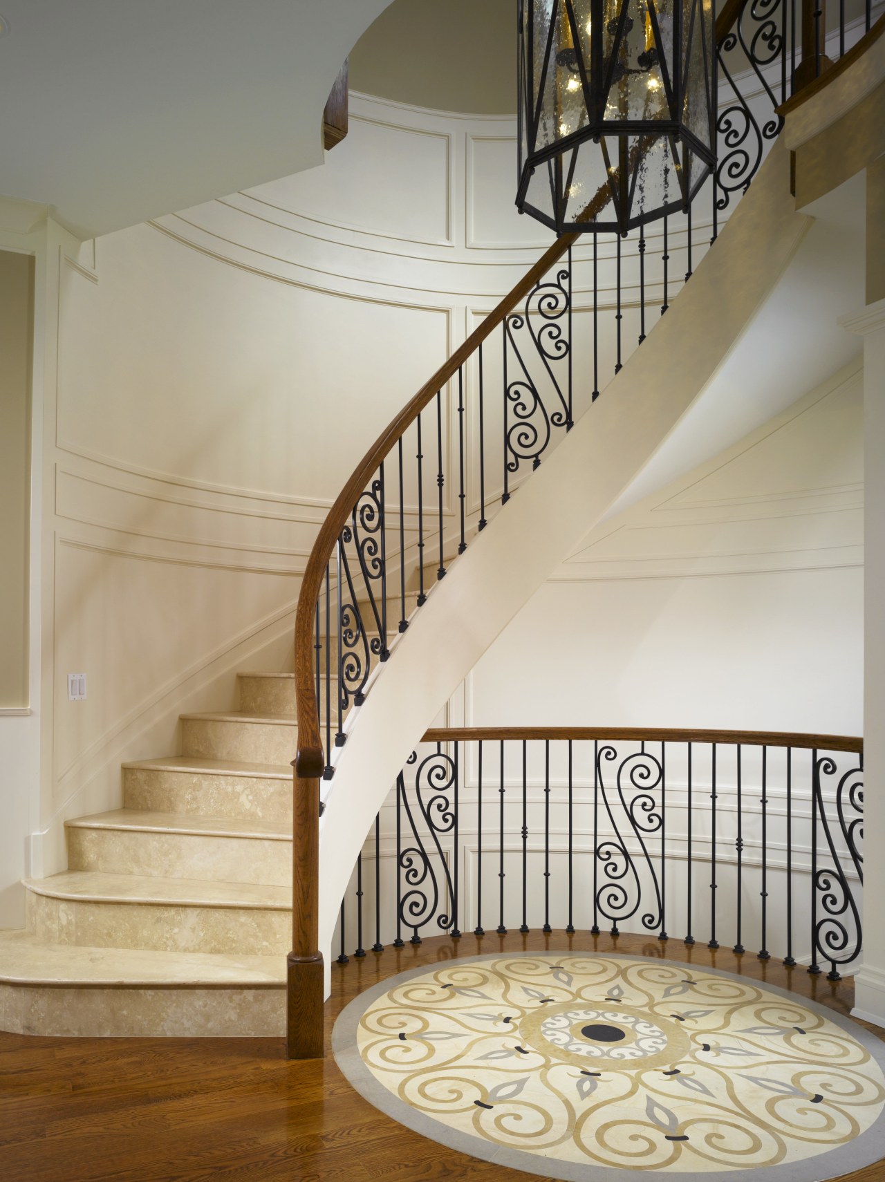 A spiral staircase and the circular mosaic inlaid baluster, estate, floor, flooring, handrail, hardwood, home, interior design, stairs, wood, wood flooring, gray