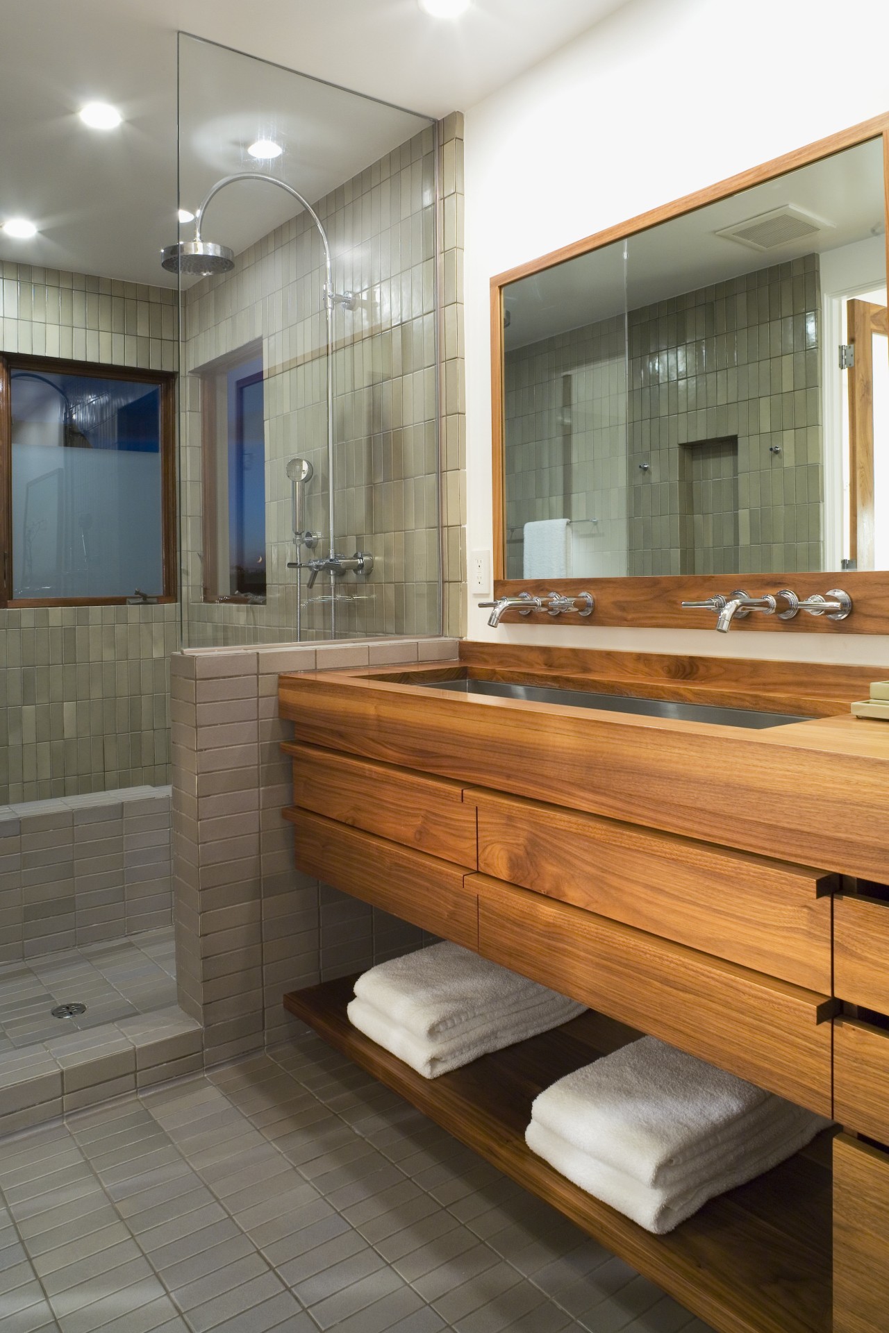 A view of a bathroom. bathroom, floor, flooring, interior design, room, gray, brown