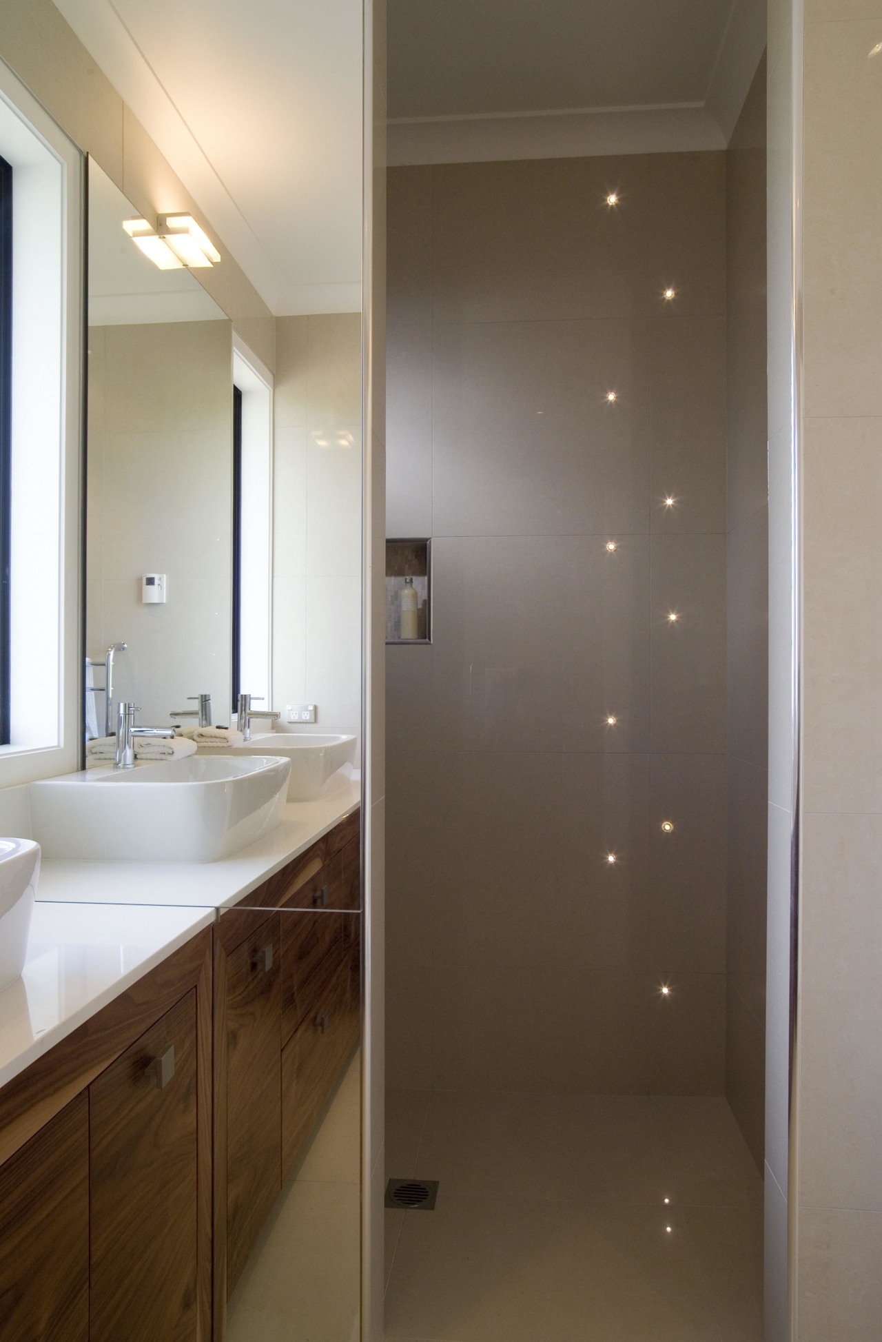 A view of some bathroom tiles from the bathroom, bathroom cabinet, ceiling, floor, glass, home, interior design, lighting, room, sink, brown, gray