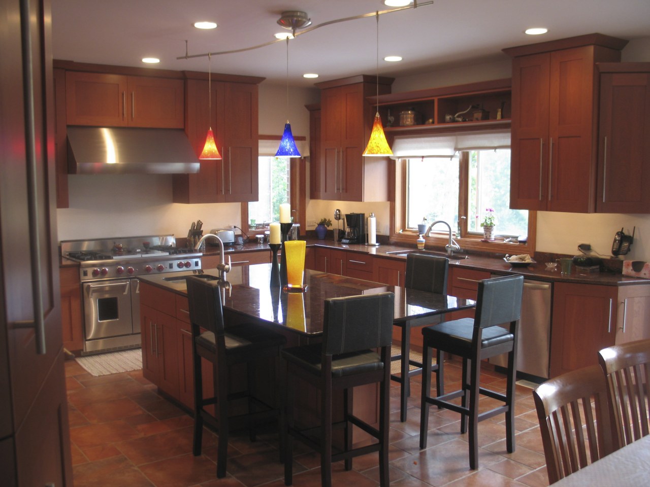 A view of this kitchen featuring a granite countertop, interior design, kitchen, room, table, red