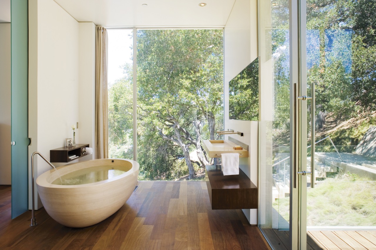 A view of the bathroom featuring oval limestone architecture, bathroom, estate, floor, home, house, interior design, property, real estate, room, window, white