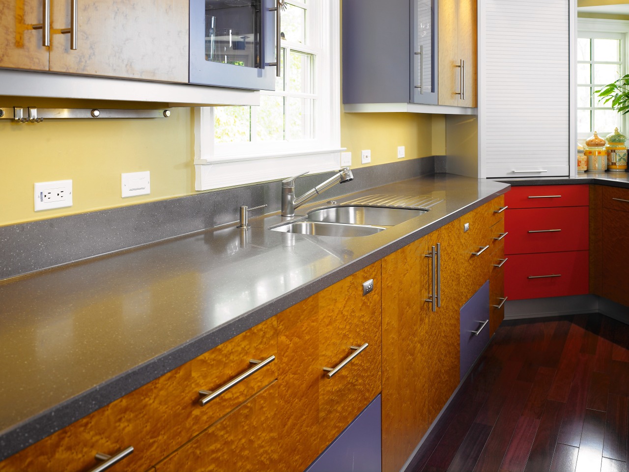 A view of this kitchen featuring the Corian cabinetry, countertop, floor, flooring, hardwood, interior design, kitchen, real estate, room, wood flooring, brown
