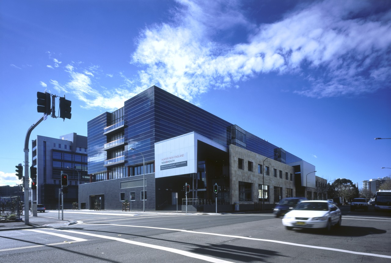 Seperate entrances for a community health centre and apartment, architecture, building, commercial building, condominium, corporate headquarters, daytime, downtown, elevation, facade, headquarters, house, metropolis, metropolitan area, mixed use, neighbourhood, property, real estate, residential area, sky, town, blue