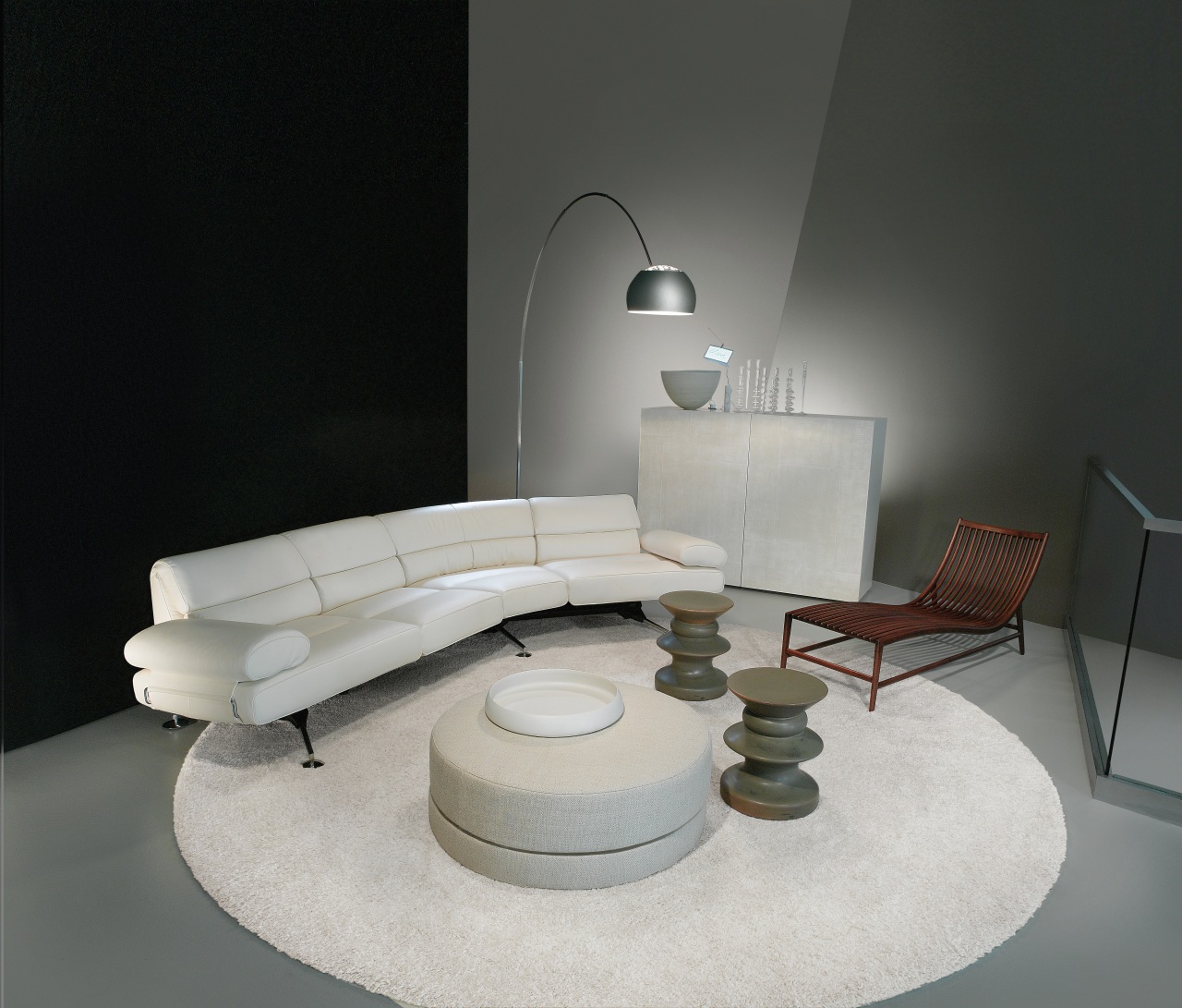 A view of some furniture from Domus Design. angle, couch, furniture, interior design, light fixture, lighting, living room, product design, table, gray, black