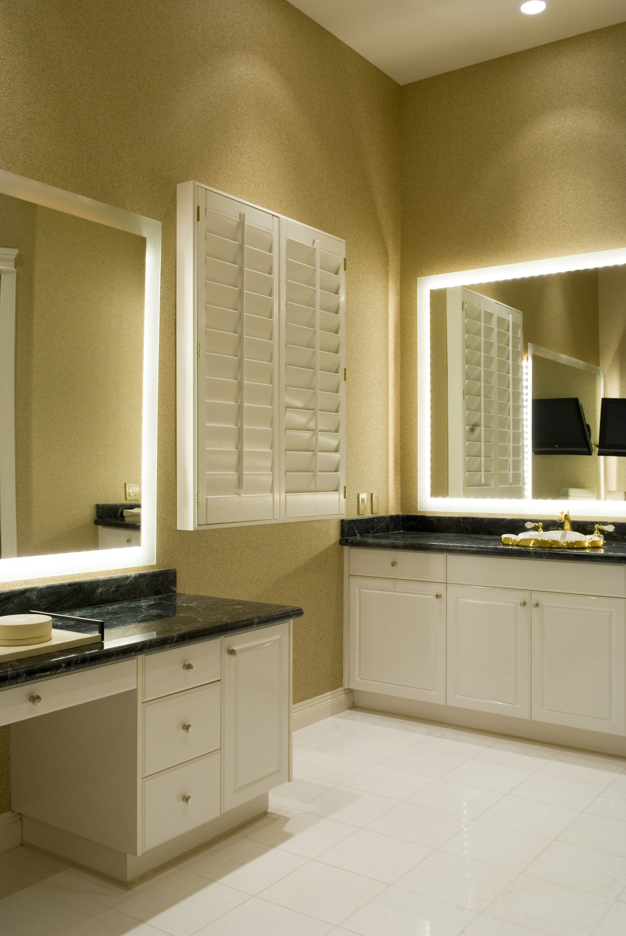 A view of the interior living areas featuring bathroom, bathroom accessory, bathroom cabinet, cabinetry, countertop, cuisine classique, floor, flooring, home, interior design, kitchen, room, sink, window, brown