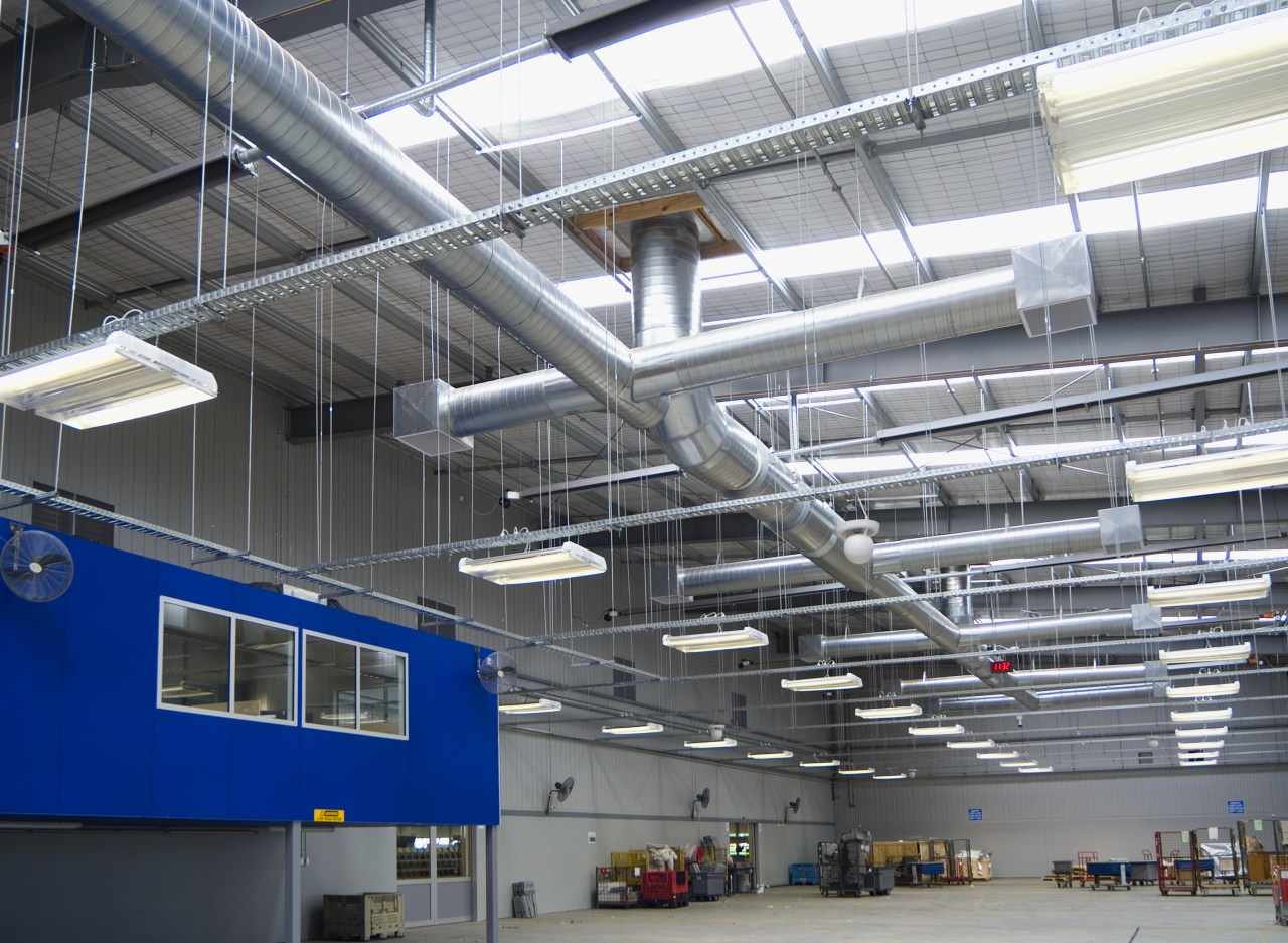 Fans in the main building are controlled via aerospace engineering, airport terminal, daylighting, engineering, factory, industry, manufacturing, steel, structure, gray