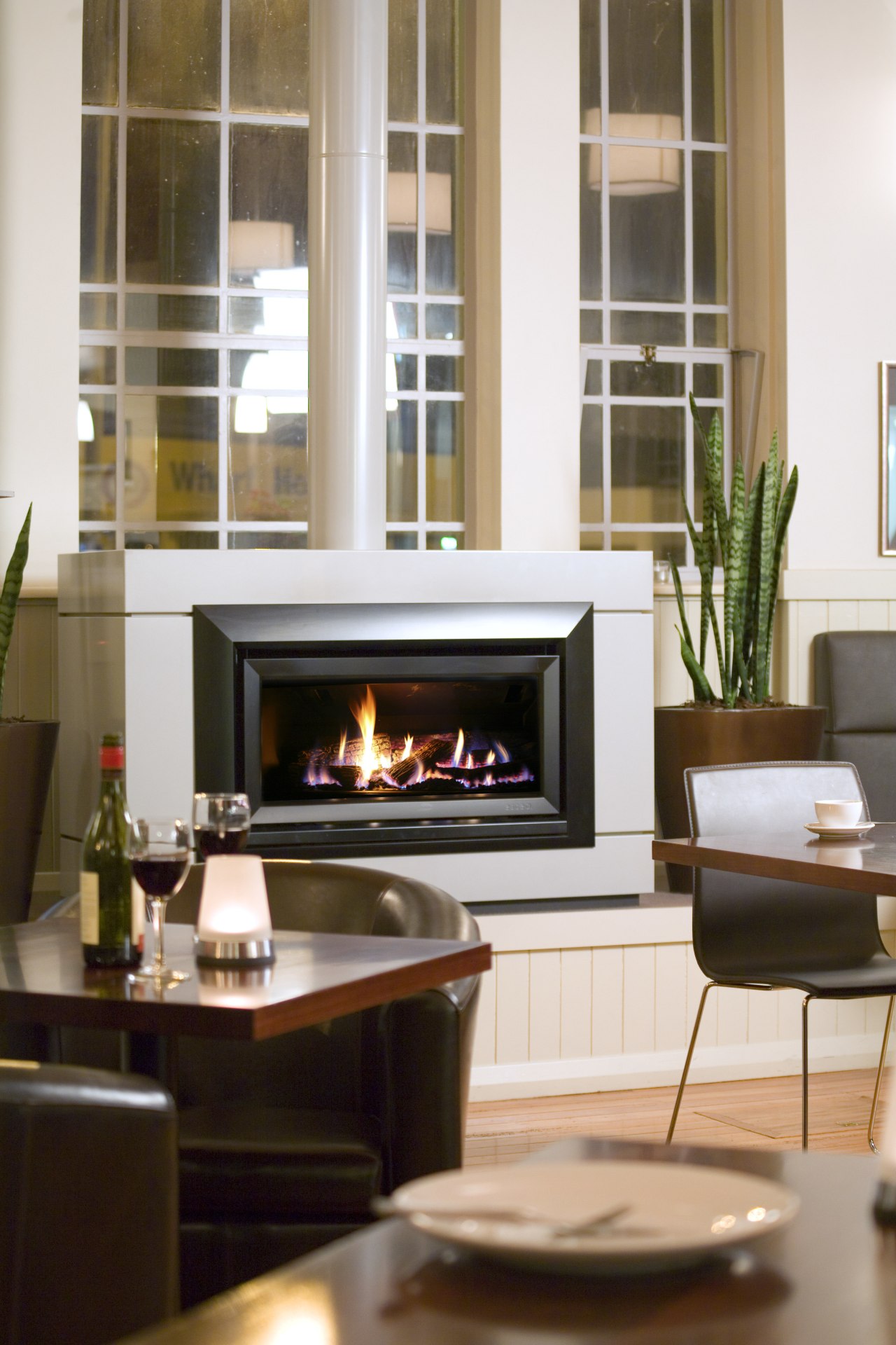 A glass-fronted gas fire from Escea allows restaurateurs fireplace, furniture, hearth, home, home appliance, interior design, living room, white, brown