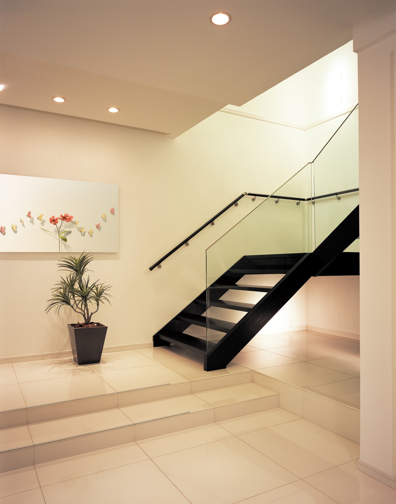 A window in the void of the stairwell architecture, ceiling, daylighting, floor, flooring, glass, handrail, interior design, lobby, product design, real estate, stairs, tile, orange