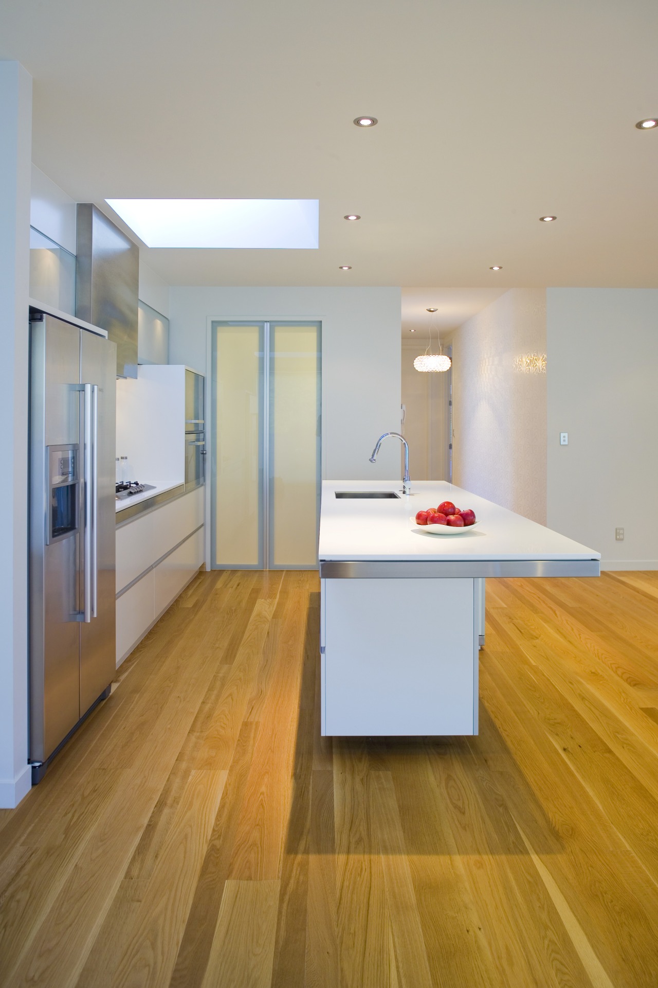 View of kitchen designed by Robyn Labb from apartment, architecture, ceiling, daylighting, floor, flooring, hardwood, house, interior design, kitchen, laminate flooring, loft, real estate, room, wood, wood flooring, gray