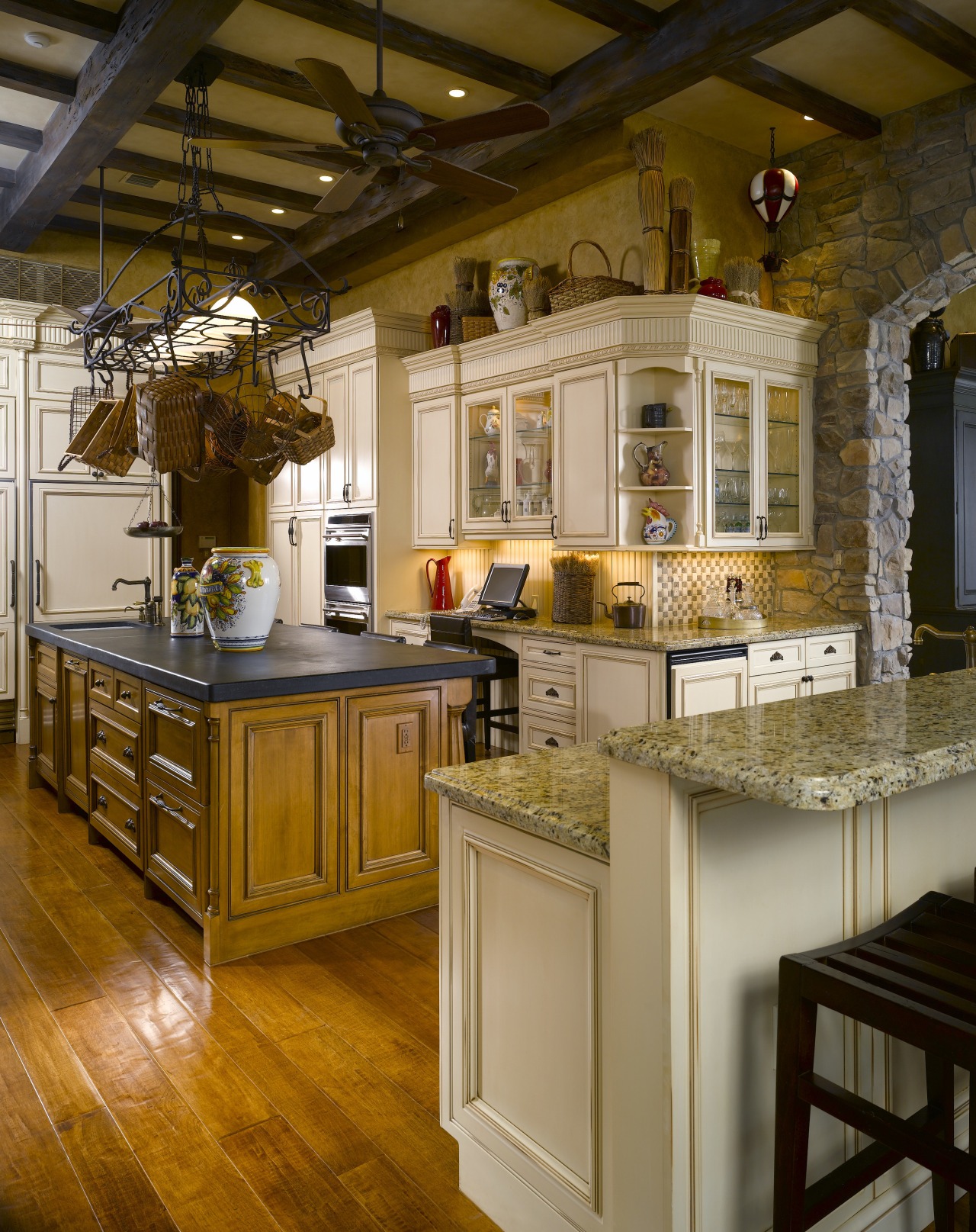 A custom-designed cast iron pot rack and antique-style cabinetry, ceiling, countertop, cuisine classique, interior design, kitchen, room, brown