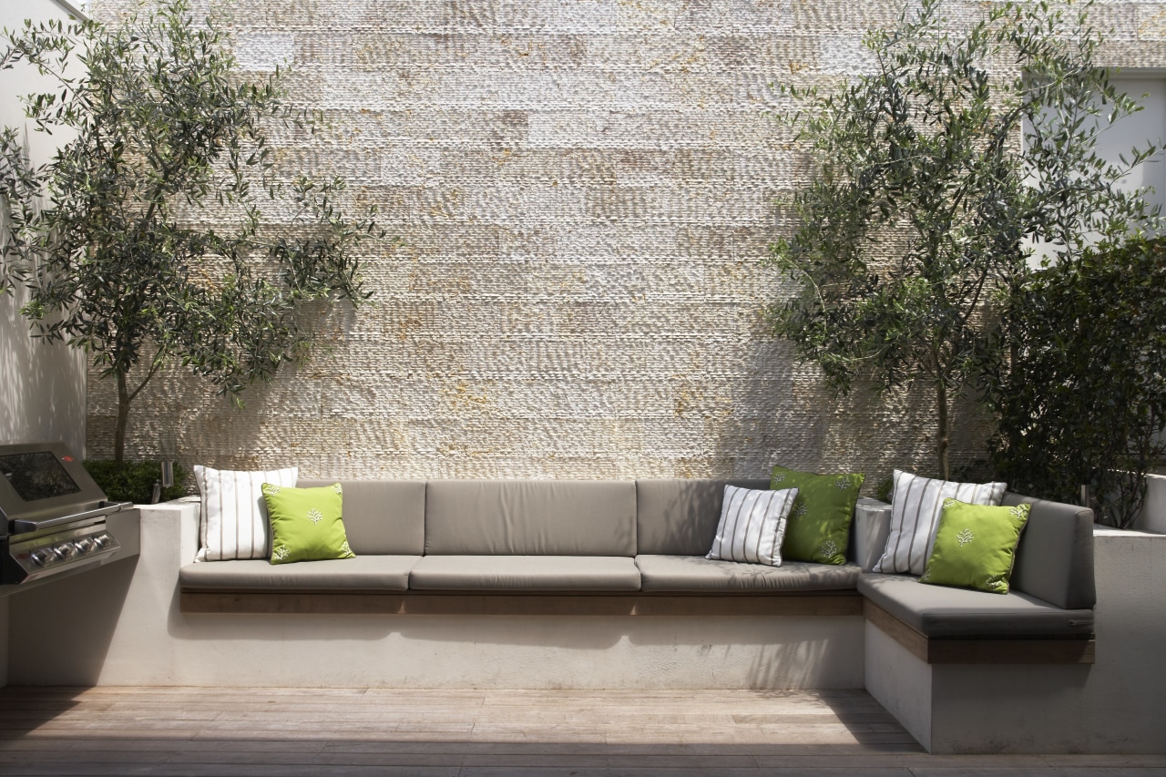 To disguise the concrete wall of the garage, couch, furniture, home, interior design, living room, outdoor furniture, patio, property, table, wall, gray