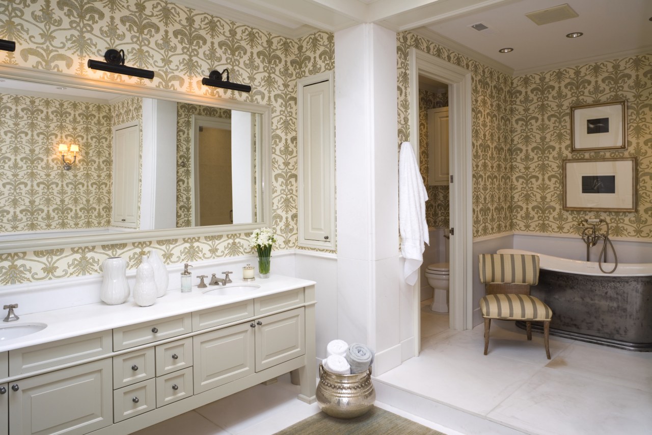 view of bathroom featuring bath tub, bathroom cabinetry, bathroom, bathroom accessory, ceiling, floor, flooring, home, interior design, room, tile, wall, window, gray, brown