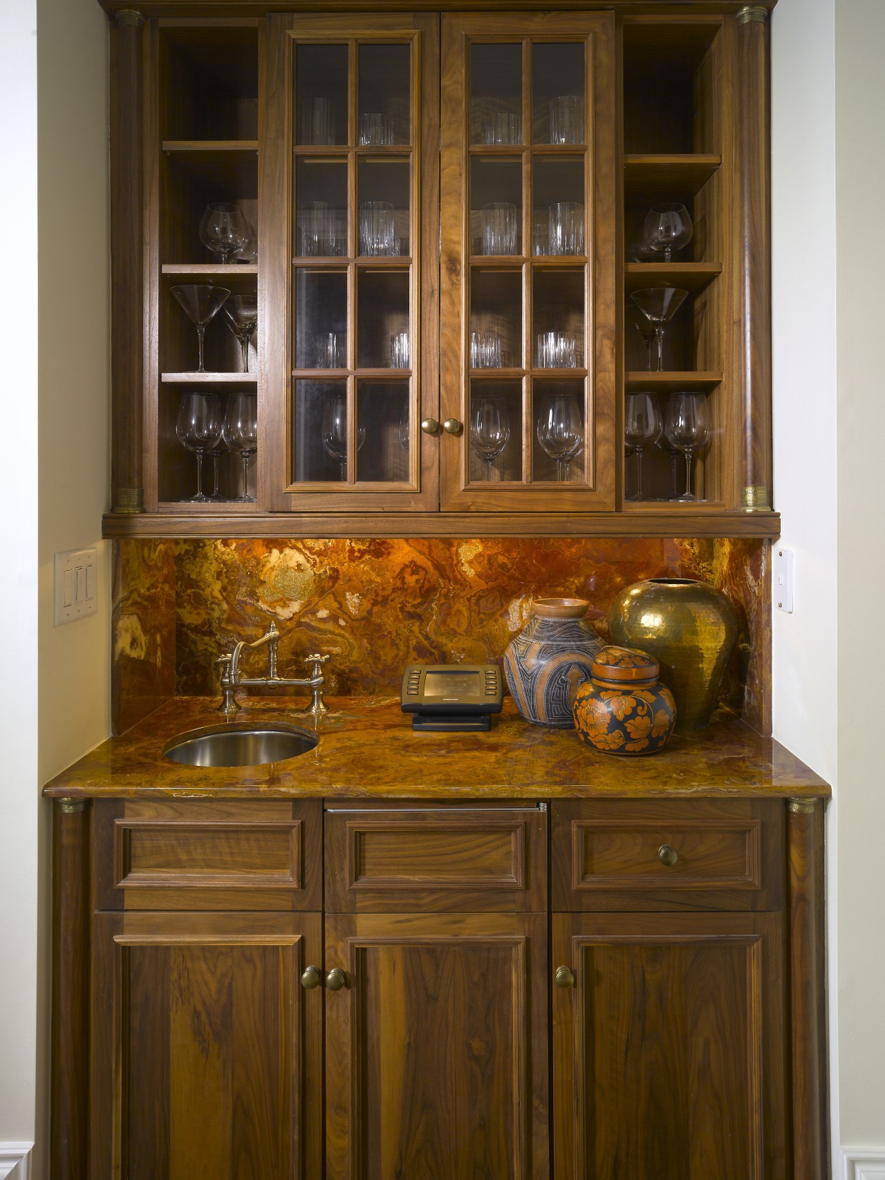 View of countertop by A Touch Of Stone. bookcase, cabinetry, chest of drawers, china cabinet, countertop, cuisine classique, cupboard, furniture, kitchen, kitchen organizer, shelf, shelving, wood stain, brown