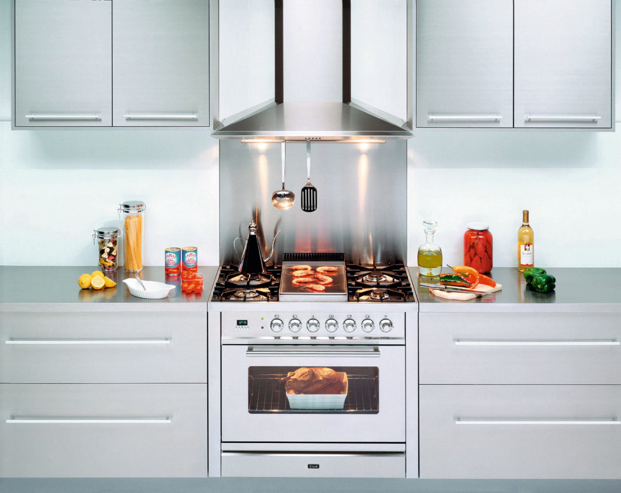 Ilve's Quadra and Nostalgie gas ovens offer expansive cabinetry, countertop, cuisine classique, gas stove, home appliance, interior design, kitchen, kitchen appliance, kitchen stove, major appliance, refrigerator, room, small appliance, white