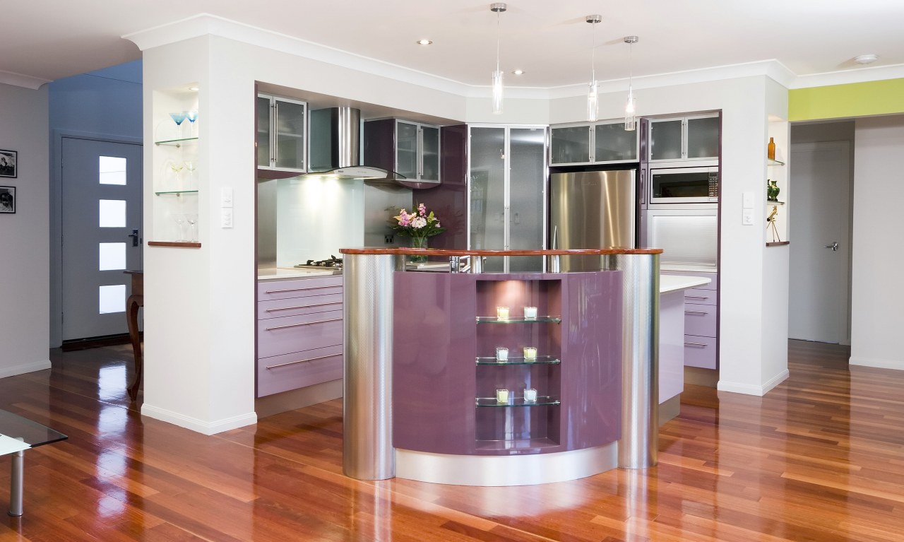 A view of a kitchen designed by KBDI. cabinetry, floor, flooring, hardwood, interior design, kitchen, property, real estate, room, wood flooring, white, red