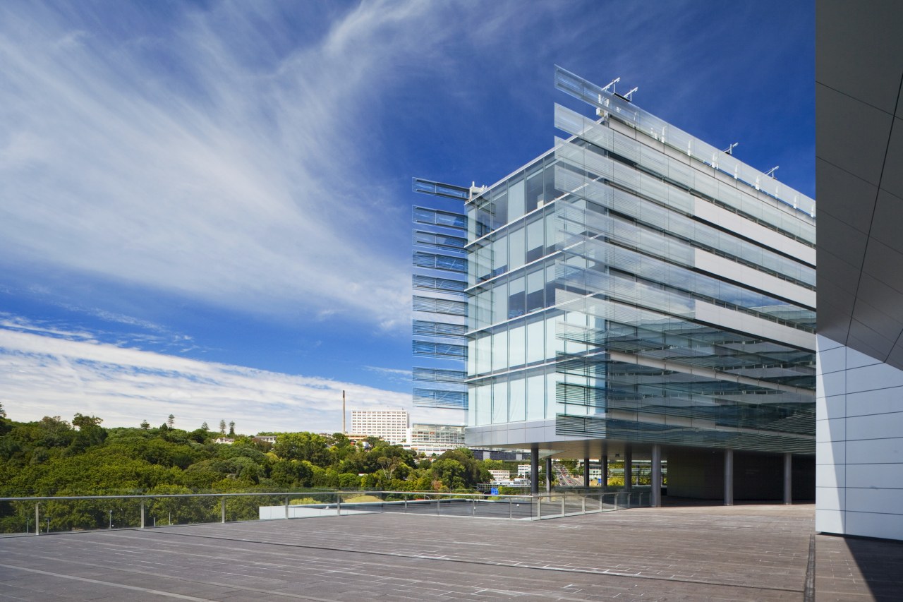 View of the Owen G Glenn Building at architecture, building, commercial building, condominium, corporate headquarters, daytime, facade, headquarters, metropolitan area, mixed use, real estate, sky, gray