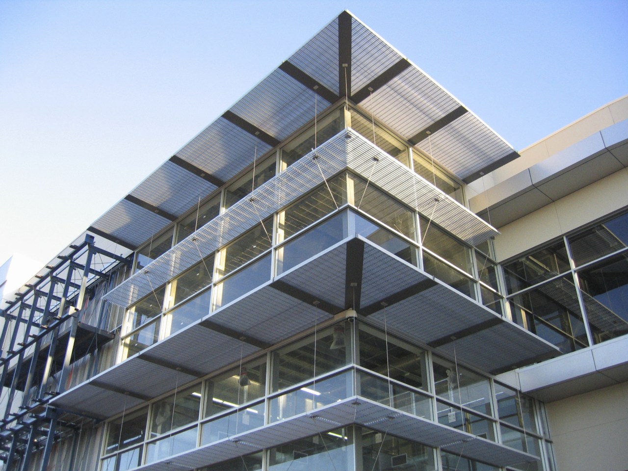 Ellise sunshade screens on contemporary building apartment, architecture, building, commercial building, condominium, corporate headquarters, daylighting, facade, headquarters, mixed use, real estate, structure, teal