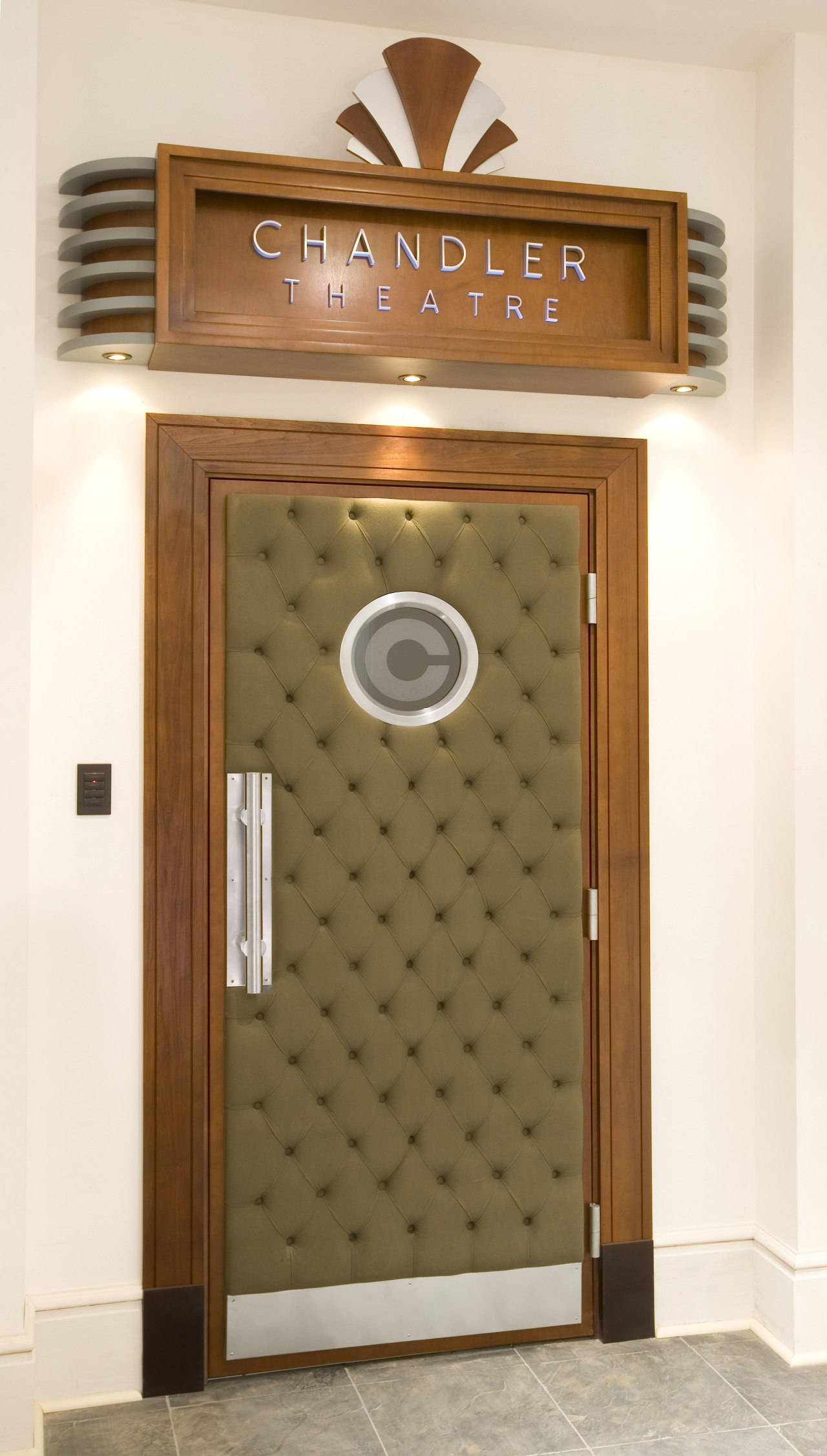 Entry door to art deco themed home theatre door, white, brown