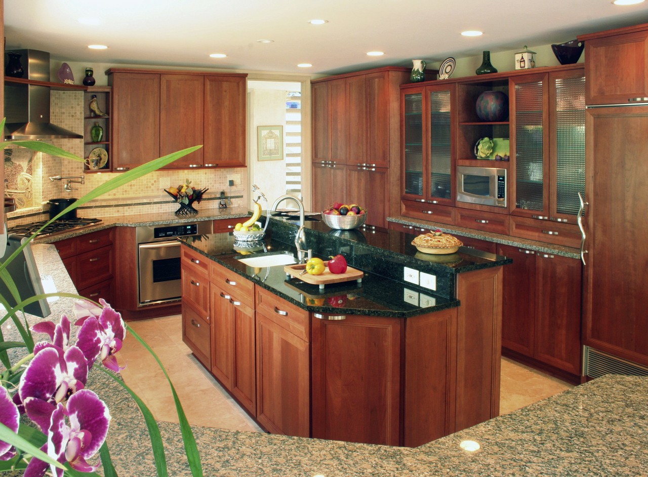 view of kitchen by Dream Kitchens, featuring cabinetry, cabinetry, countertop, cuisine classique, interior design, kitchen, room, orange