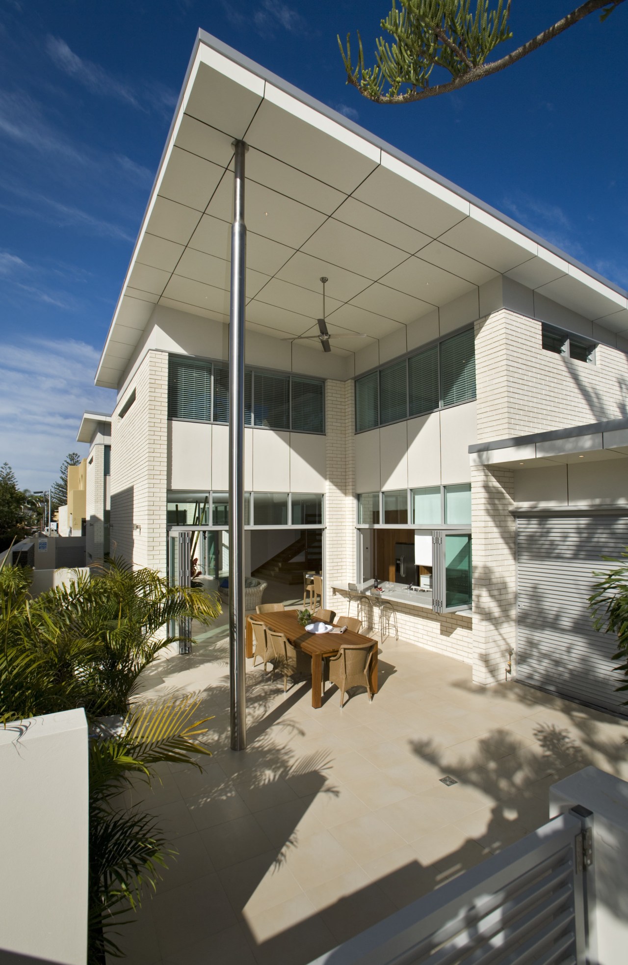 View of open-plan brick house with stainless steel architecture, daylighting, facade, home, house, real estate, roof, shade, gray