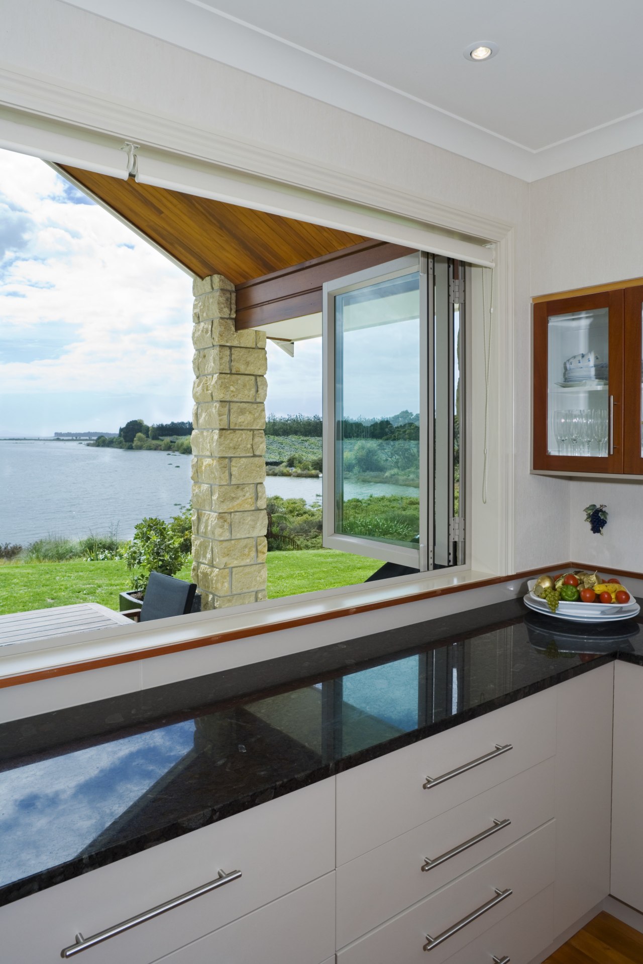 Kitchen with large bi-folding windows inside contemporary home architecture, countertop, daylighting, estate, home, house, interior design, kitchen, real estate, window, gray