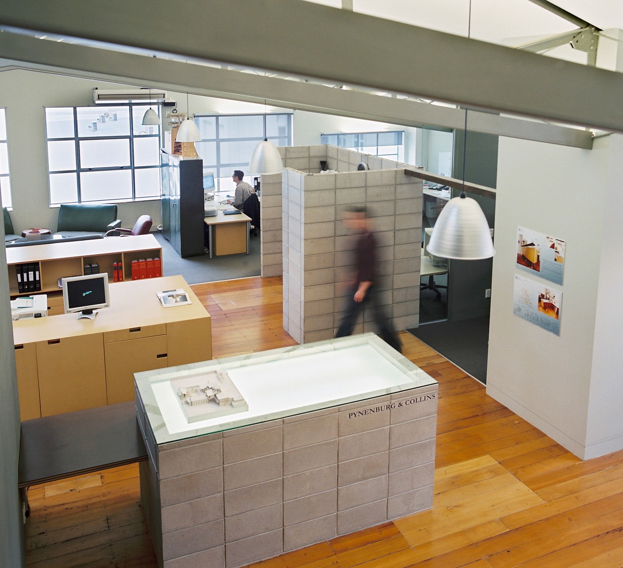 Visitors to Pynenburg and Collins' studio approach a furniture, interior design, product design, gray