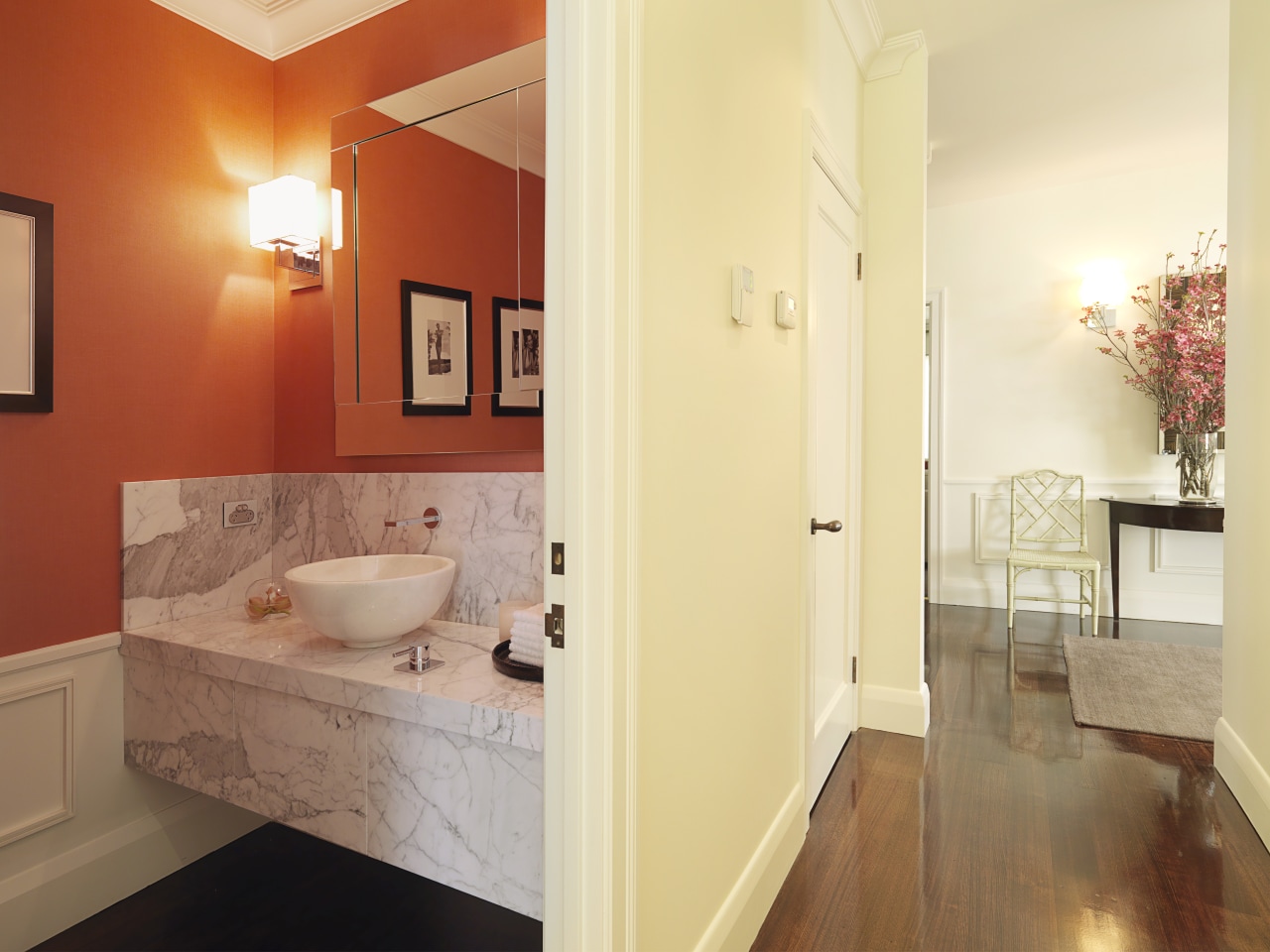 View of powder room with a marble vanity architecture, bathroom, ceiling, estate, floor, flooring, hardwood, home, interior design, laminate flooring, property, real estate, room, tile, wall, wood flooring, orange