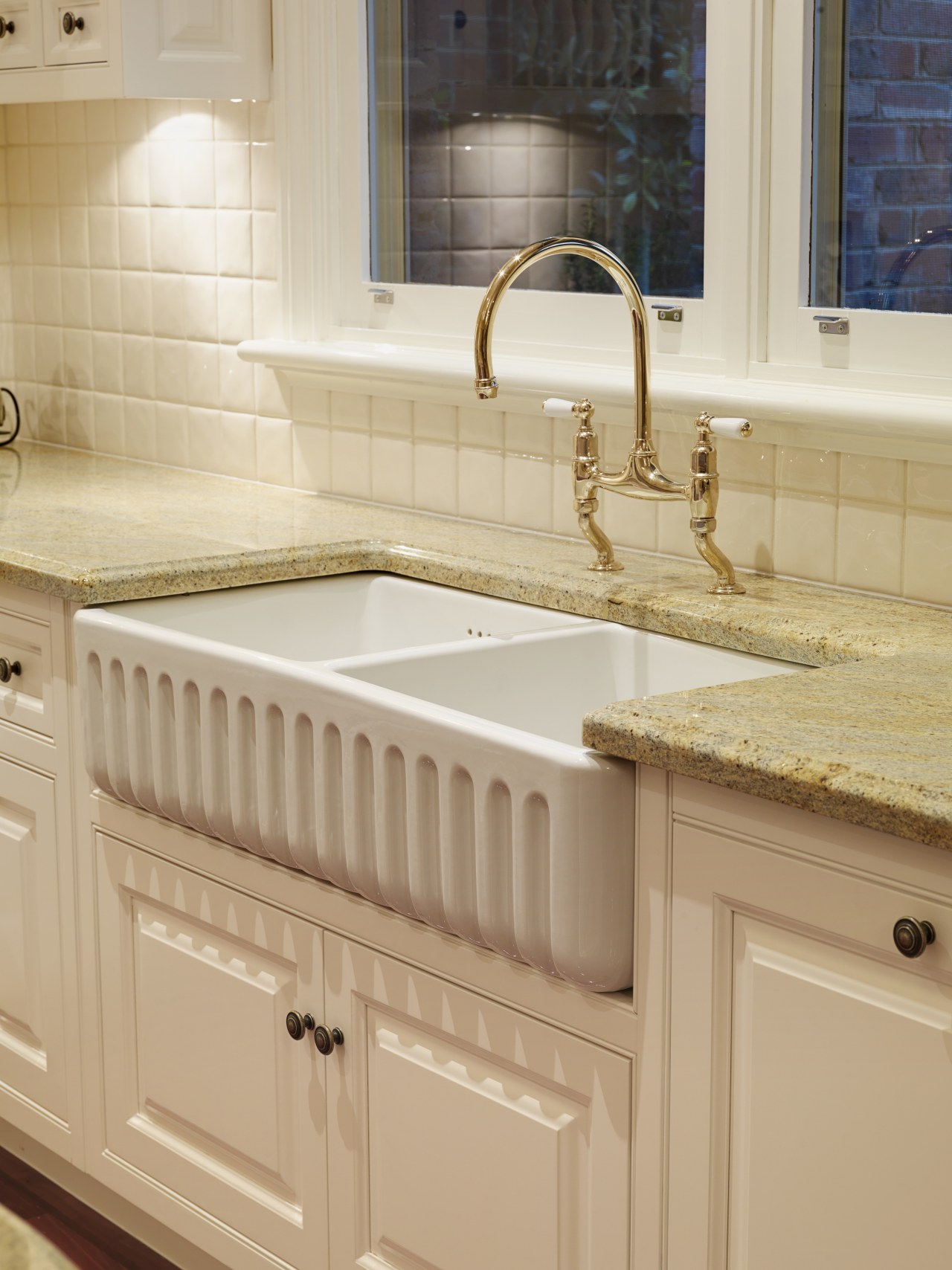 View of the double butler's sink which features bathroom, bathroom accessory, bathroom cabinet, bathroom sink, cabinetry, ceramic, countertop, floor, flooring, hardwood, kitchen, plumbing fixture, room, sink, tap, tile, wood stain, orange